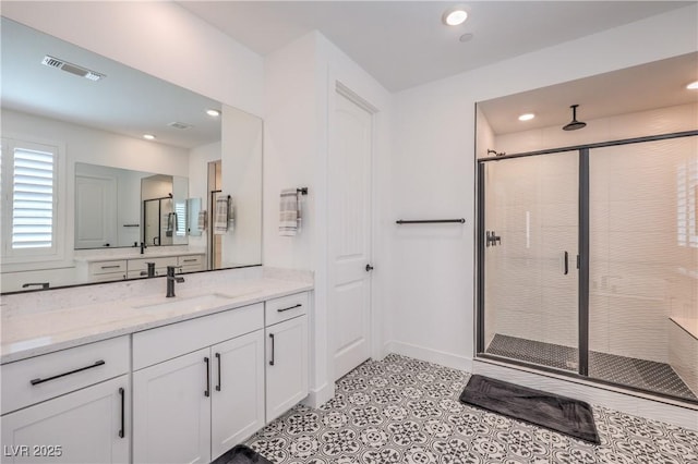 201 Carmel Sky St, Las Vegas, NV 89138 - bathroom featuring a shower stall, vanity, recessed lighting, and tile patterned floors
