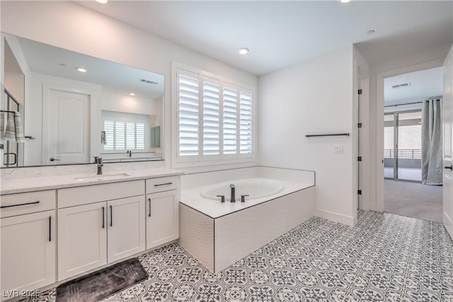 201 Carmel Sky St, Las Vegas, NV 89138 - full bathroom featuring vanity, a garden tub, and recessed lighting