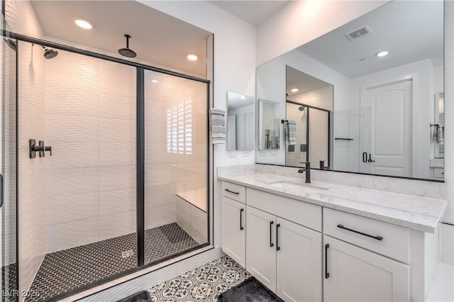 201 Carmel Sky St, Las Vegas, NV 89138 - bathroom featuring a shower stall, vanity, recessed lighting, and tile patterned flooring
