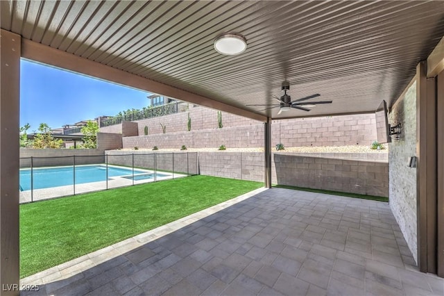 201 Carmel Sky St, Las Vegas, NV 89138 - fenced backyard featuring a patio and ceiling fan