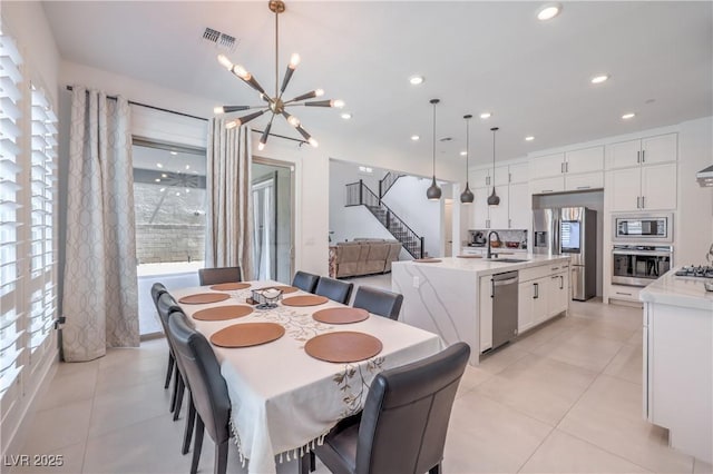 201 Carmel Sky St, Las Vegas, NV 89138 - dining space featuring light tile patterned floors, a chandelier, stairway, and recessed lighting