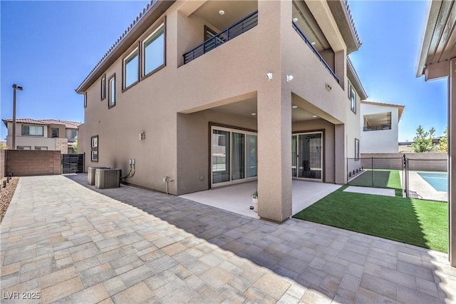 201 Carmel Sky St, Las Vegas, NV 89138 - back of property with stucco siding and a patio area
