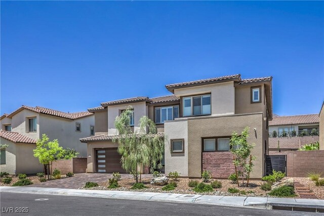 201 Carmel Sky St, Las Vegas, NV 89138 - mediterranean / spanish-style house with an attached garage, a tiled roof, stucco siding, and driveway