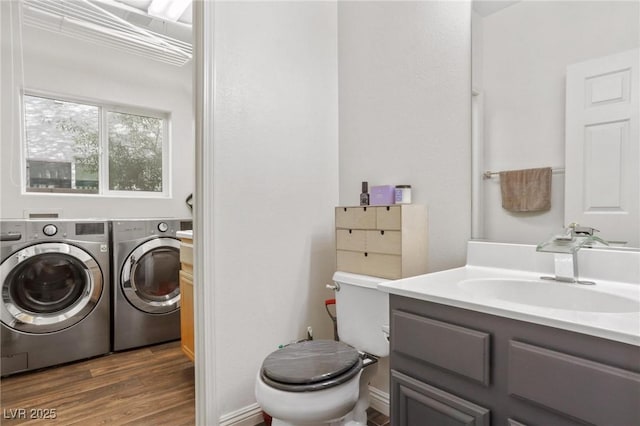3632 Julia Waldene Ct, Las Vegas, NV 89129 - bathroom featuring washing machine and clothes dryer, wood finished floors, toilet, and vanity