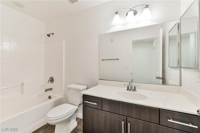 full bath with toilet, vanity, and shower / tub combination