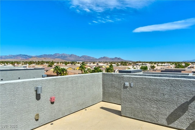 balcony with a mountain view and a residential view