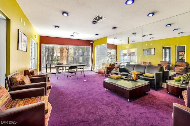 carpeted living room featuring plenty of natural light
