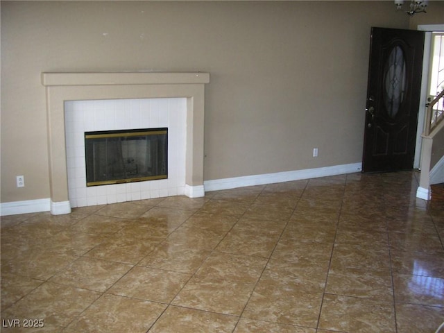 1927 Raspberry Hill Rd, Las Vegas, NV 89142 - unfurnished living room with baseboards and a tiled fireplace