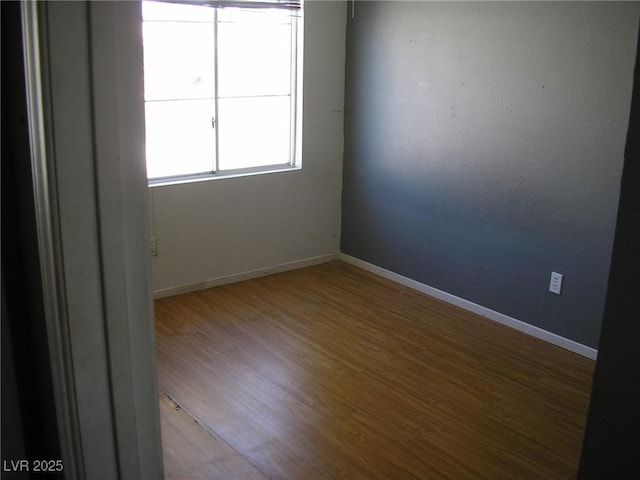 1927 Raspberry Hill Rd, Las Vegas, NV 89142 - empty room with wood finished floors and baseboards