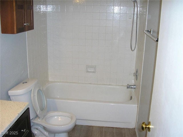 1927 Raspberry Hill Rd, Las Vegas, NV 89142 - bathroom with toilet, vanity, wood finished floors, and shower / washtub combination