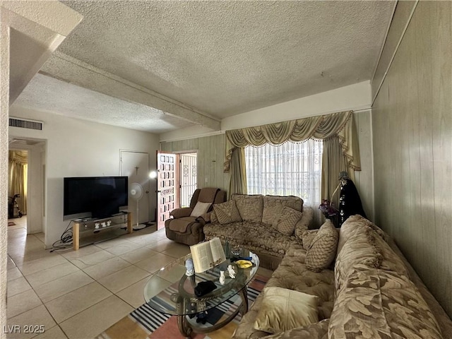 2300 Pardee Pl, Las Vegas, NV 89104 - tiled living area featuring wooden walls and a textured ceiling