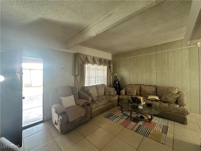 2300 Pardee Pl, Las Vegas, NV 89104 - tiled living room featuring wooden walls, beam ceiling, and a textured ceiling