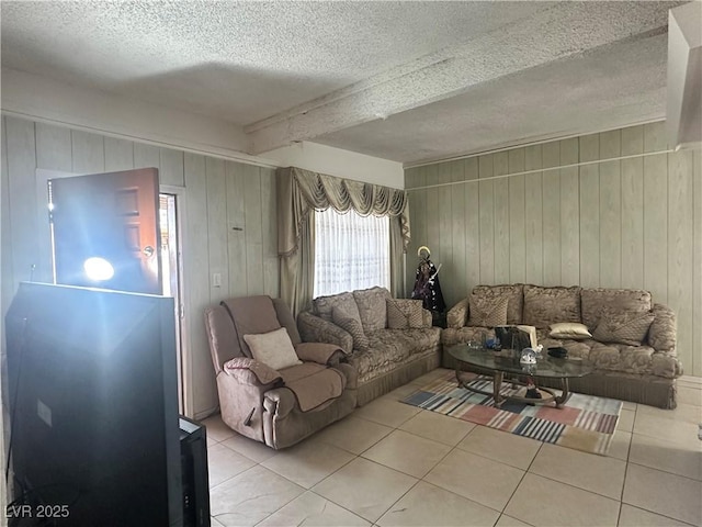 2300 Pardee Pl, Las Vegas, NV 89104 - living area featuring tile patterned flooring, a textured ceiling, wood walls, and beamed ceiling