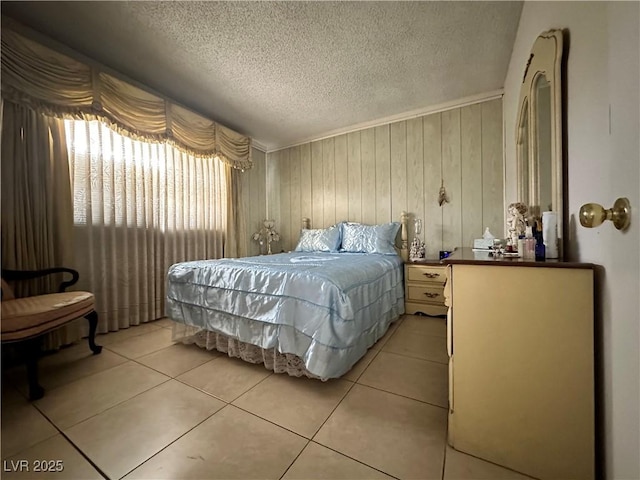 2300 Pardee Pl, Las Vegas, NV 89104 - bedroom featuring a textured ceiling, light tile patterned flooring, and wooden walls