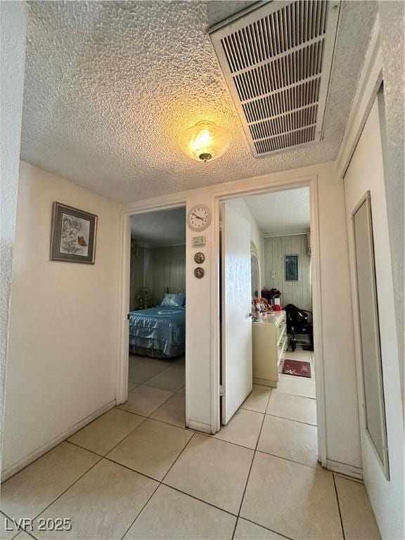 2300 Pardee Pl, Las Vegas, NV 89104 - hall featuring light tile patterned floors and a textured ceiling