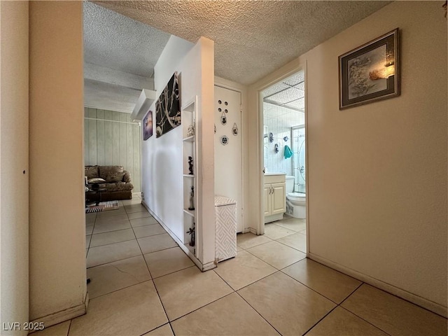 2300 Pardee Pl, Las Vegas, NV 89104 - corridor with a textured ceiling and light tile patterned flooring