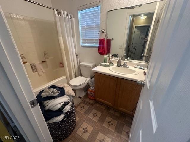 full bathroom featuring vanity, toilet, and shower / bath combination with curtain