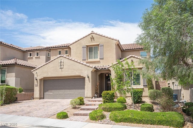 3698 Regatta Landing Dr, Las Vegas, NV 89141 - mediterranean / spanish home featuring stucco siding, a tile roof, and decorative driveway