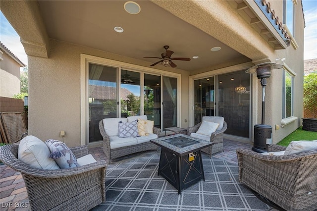 3698 Regatta Landing Dr, Las Vegas, NV 89141 - view of patio with an outdoor living space with a fire pit and ceiling fan