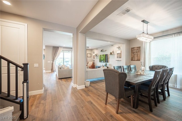 3698 Regatta Landing Dr, Las Vegas, NV 89141 - dining room featuring baseboards, stairs, wood finished floors, and recessed lighting