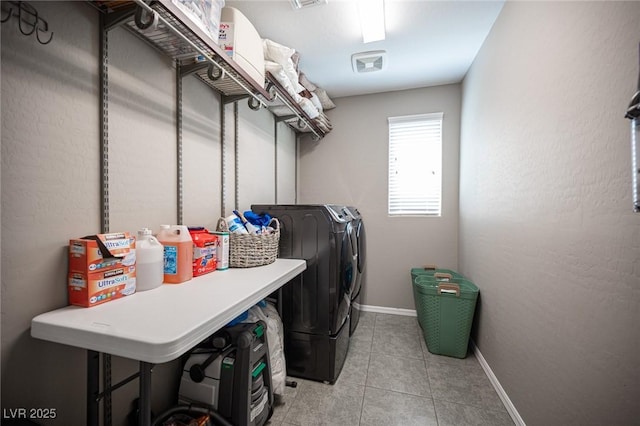 3698 Regatta Landing Dr, Las Vegas, NV 89141 - washroom with washer and dryer, light tile patterned floors, and baseboards