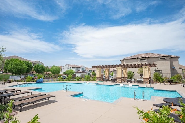 3698 Regatta Landing Dr, Las Vegas, NV 89141 - community pool with a pergola, fence, and a patio