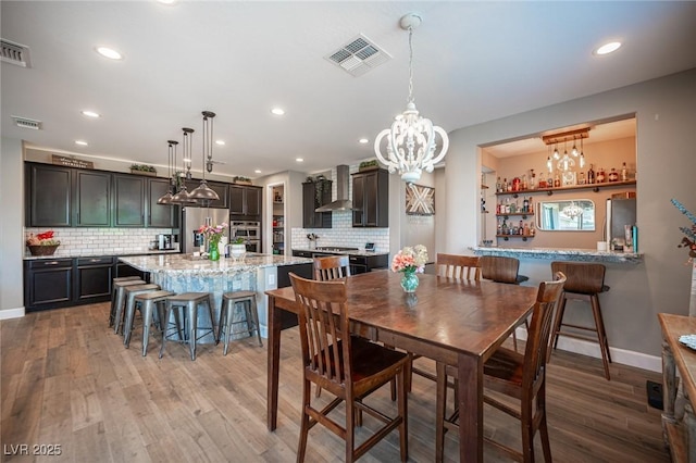 3698 Regatta Landing Dr, Las Vegas, NV 89141 - dining area featuring light wood finished floors, recessed lighting, a chandelier, and baseboards