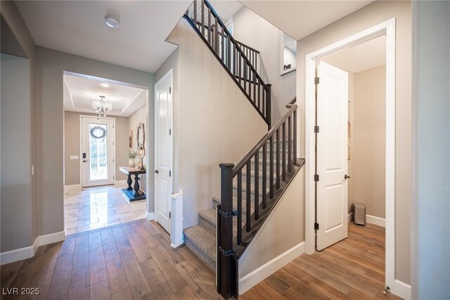 3698 Regatta Landing Dr, Las Vegas, NV 89141 - staircase featuring wood-type flooring and baseboards
