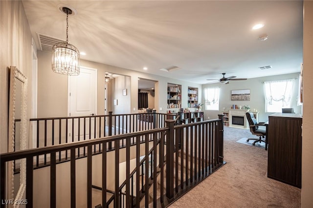 3698 Regatta Landing Dr, Las Vegas, NV 89141 - hall with an upstairs landing, carpet flooring, an office area, recessed lighting, and a chandelier