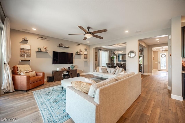 3698 Regatta Landing Dr, Las Vegas, NV 89141 - living room featuring a ceiling fan, light wood-style flooring, plenty of natural light, baseboards, and recessed lighting