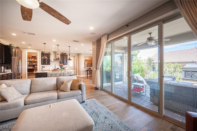 3698 Regatta Landing Dr, Las Vegas, NV 89141 - living area featuring ceiling fan, light wood-style flooring, recessed lighting, and baseboards