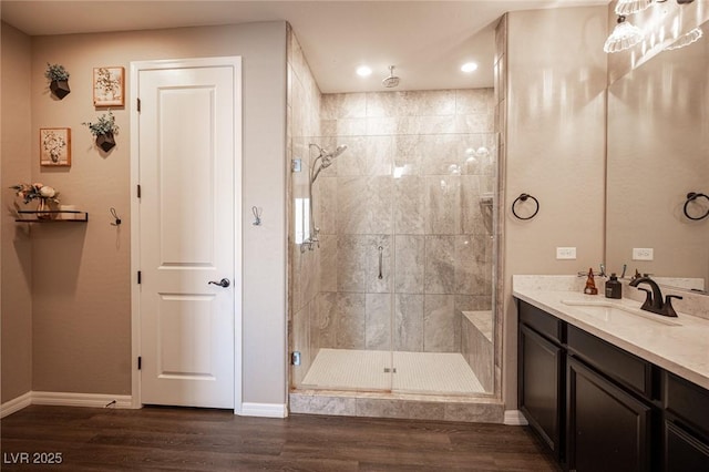 3698 Regatta Landing Dr, Las Vegas, NV 89141 - full bathroom with a stall shower, baseboards, vanity, recessed lighting, and wood finished floors
