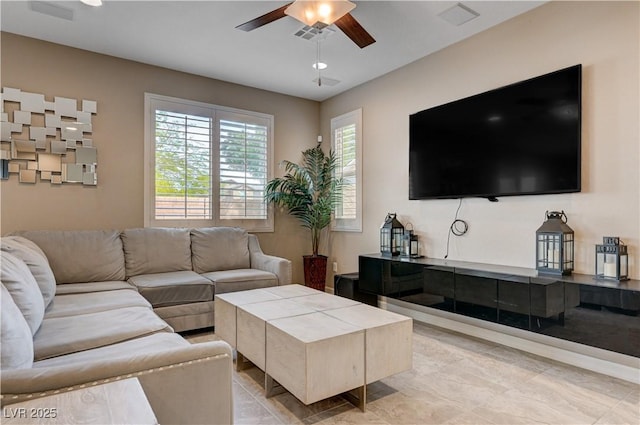 living area with ceiling fan
