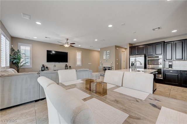 dining space with ceiling fan, recessed lighting, and light tile patterned floors
