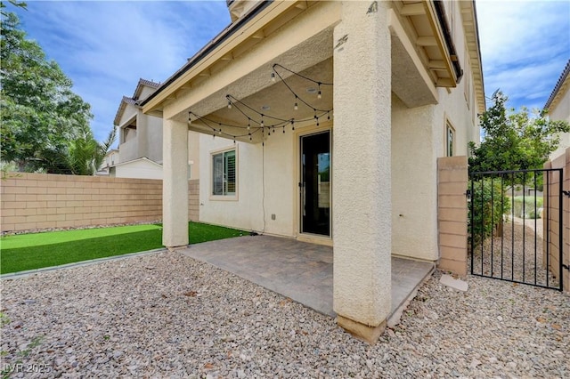 view of patio / terrace featuring a gate