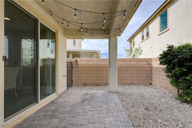 view of patio / terrace featuring fence