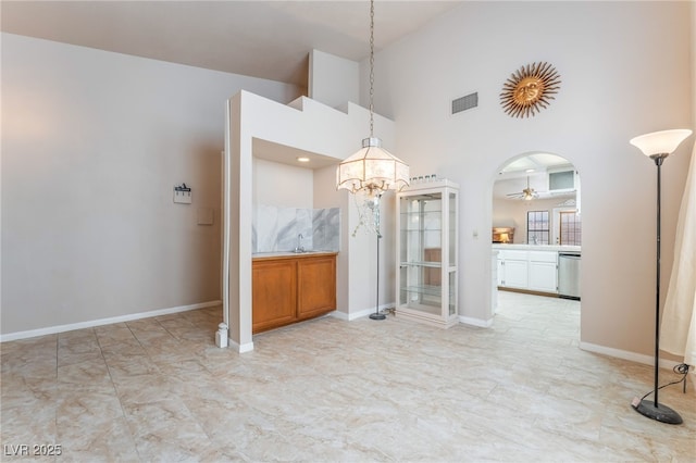4378 Cherrystone Ct, Las Vegas, NV 89121 - unfurnished dining area with a ceiling fan, high vaulted ceiling, a chandelier, and arched walkways