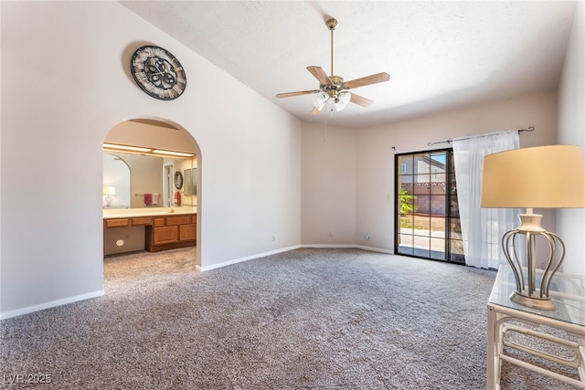 4378 Cherrystone Ct, Las Vegas, NV 89121 - unfurnished bedroom with carpet floors, arched walkways, ensuite bath, and a textured ceiling