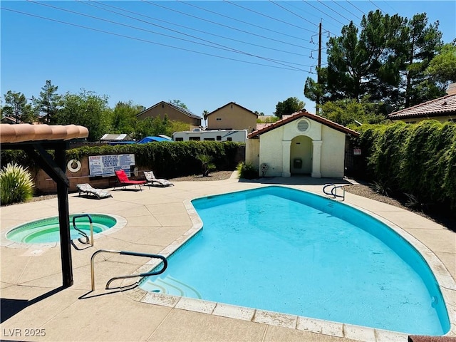 4378 Cherrystone Ct, Las Vegas, NV 89121 - community pool with a community hot tub, a patio, a fenced backyard, and an outdoor structure