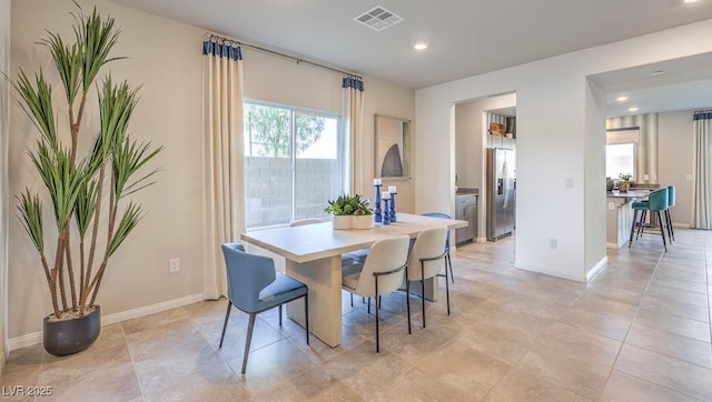 dining area featuring plenty of natural light, recessed lighting, and baseboards
