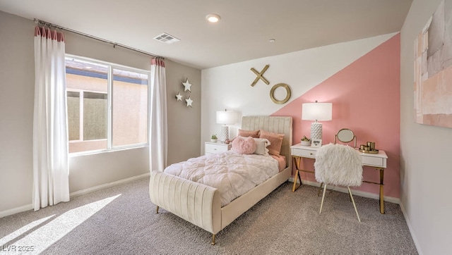 carpeted bedroom with baseboards and lofted ceiling