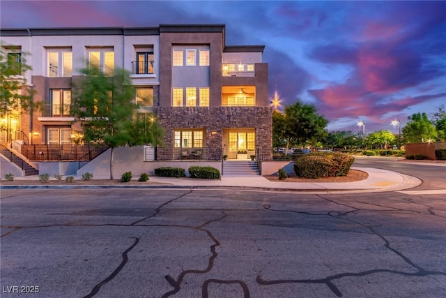 3165 Via Como Dr, Henderson, NV 89044 - view of front of property with stucco siding, stairway, and stone siding
