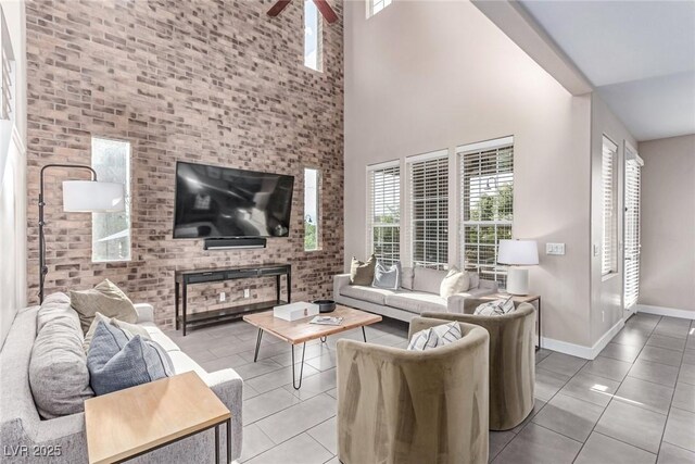 3165 Via Como Dr, Henderson, NV 89044 - tiled living room with a towering ceiling, baseboards, and ceiling fan