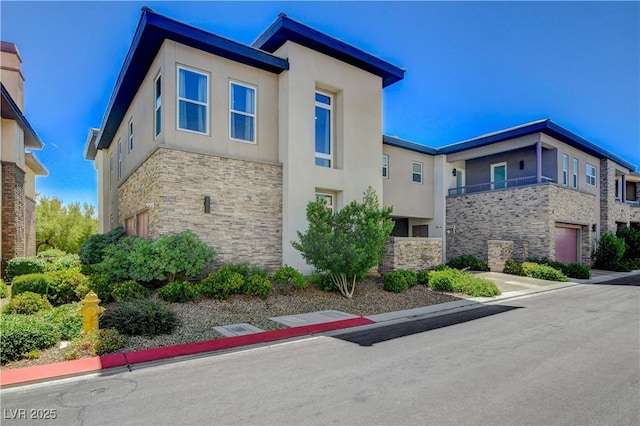 11280 Granite Ridge Dr Unit 1035, Las Vegas, NV 89135 - view of building exterior with a garage