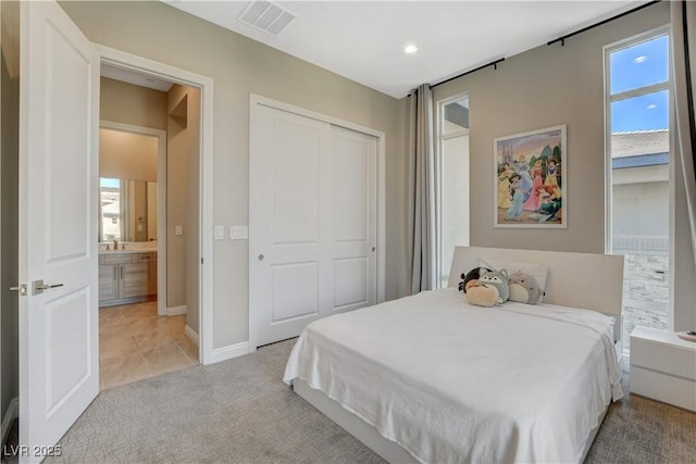 11280 Granite Ridge Dr Unit 1035, Las Vegas, NV 89135 - bedroom with multiple windows, a closet, light colored carpet, light tile patterned floors, and recessed lighting