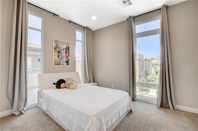 11280 Granite Ridge Dr Unit 1035, Las Vegas, NV 89135 - bedroom featuring multiple windows, light colored carpet, and baseboards