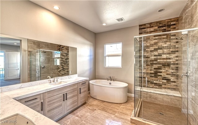 11280 Granite Ridge Dr Unit 1035, Las Vegas, NV 89135 - full bath featuring vanity, a freestanding tub, a shower stall, healthy amount of natural light, and recessed lighting