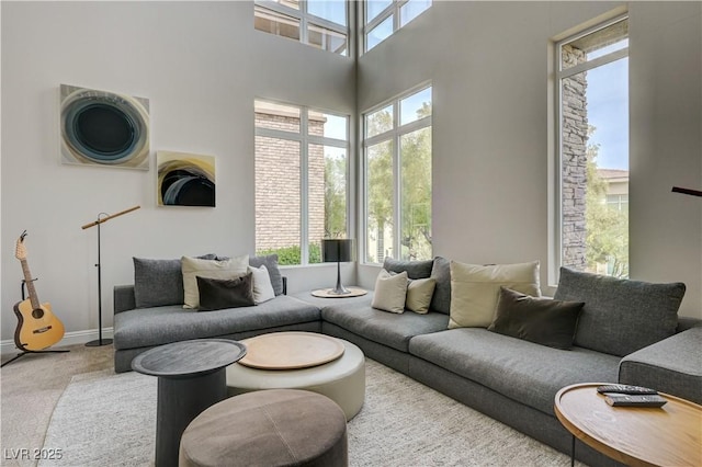 11280 Granite Ridge Dr Unit 1035, Las Vegas, NV 89135 - living area with carpet, a towering ceiling, and baseboards