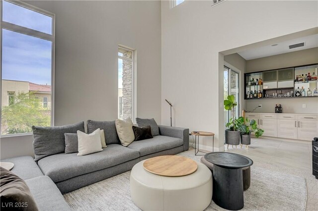 11280 Granite Ridge Dr Unit 1035, Las Vegas, NV 89135 - living area with a bar and baseboards