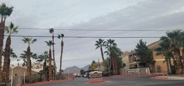 1830 N Pecos Rd Unit 155, Las Vegas, NV 89115 - view of asphalt road featuring curbs and a mountain view
